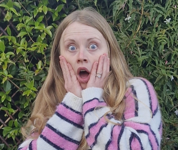 Holly surprised as she imagines the content of her forthcoming script.